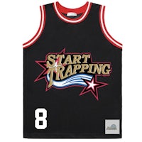 a black basketball jersey with the word start trapping on it